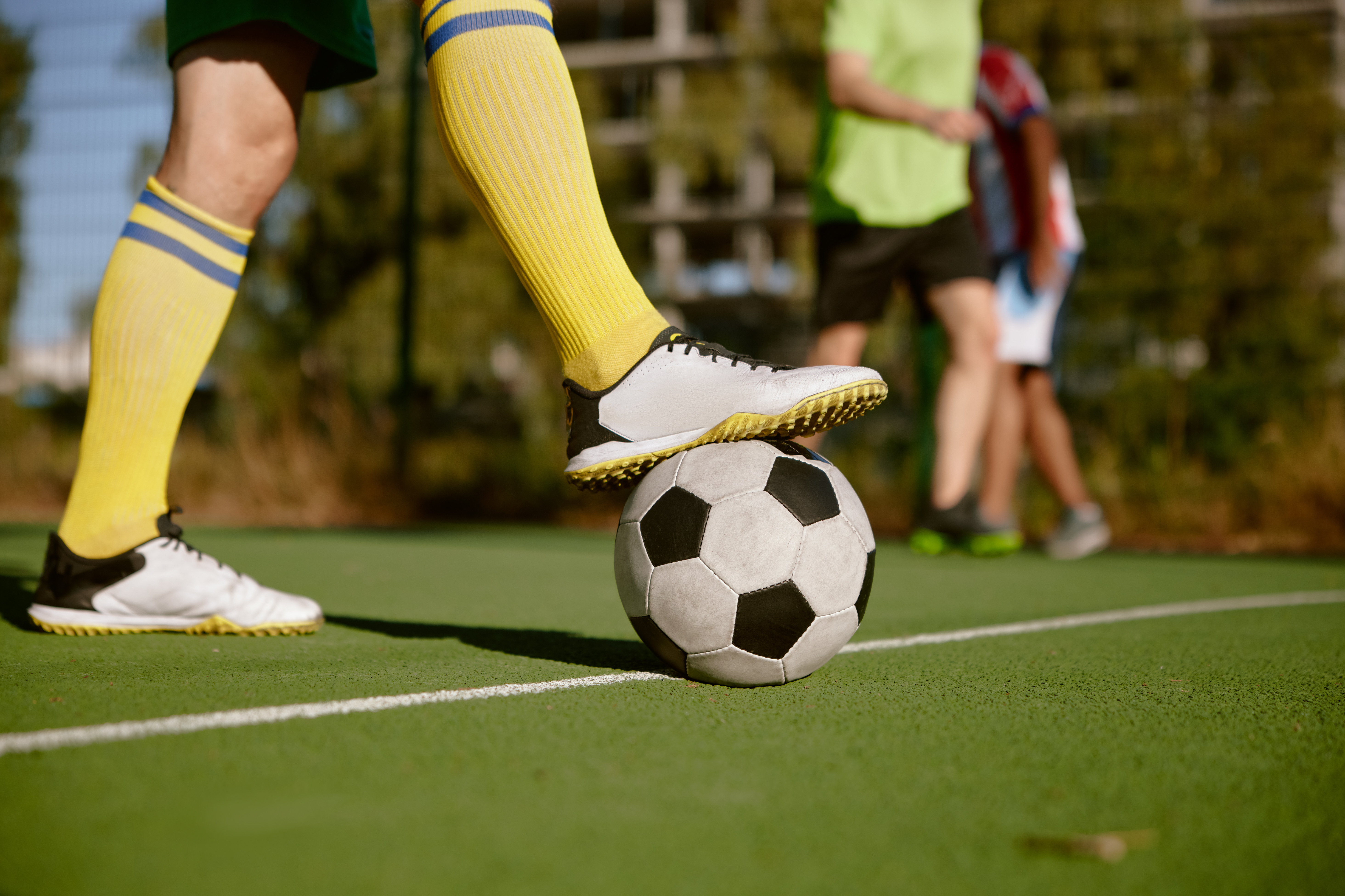 Soccer ball at the edge of a community field